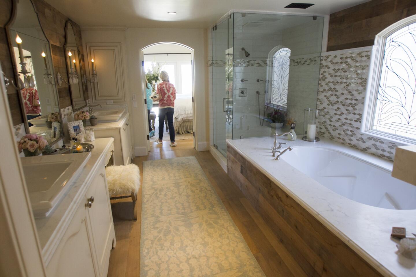 Guests take a look at the view from the master bathroom at the Buntmann Residence at 2054 East Oceanfront during the Newport Harbor Home tour on Thursday, May 15. (Scott Smeltzer - Daily Pilot)