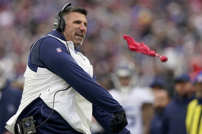 Tennessee Titans head coach Mike Vrabel throws the challenge flag during the first half of an NFL football game against the New England Patriots, Sunday, Nov. 28, 2021, in Foxborough, Mass. (AP Photo/Steven Senne)