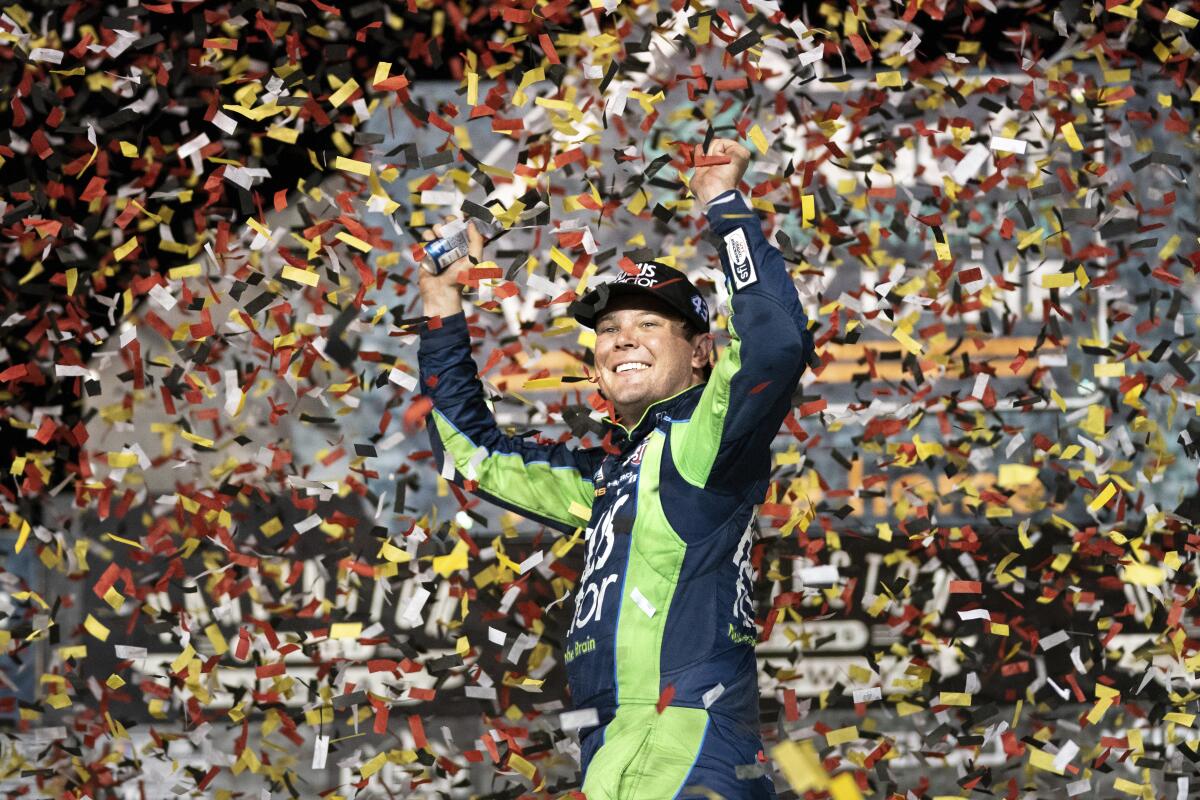 Erik Jones celebrates in the Winner's Circle after the NASCAR Southern 500 auto race Sunday, Sept. 4, 2022, in Darlington, S.C. Jones held on to the victory after taking the lead from Kyle Busch, who blew a motor with 30 laps remaining. (AP Photo/Sean Rayford)
