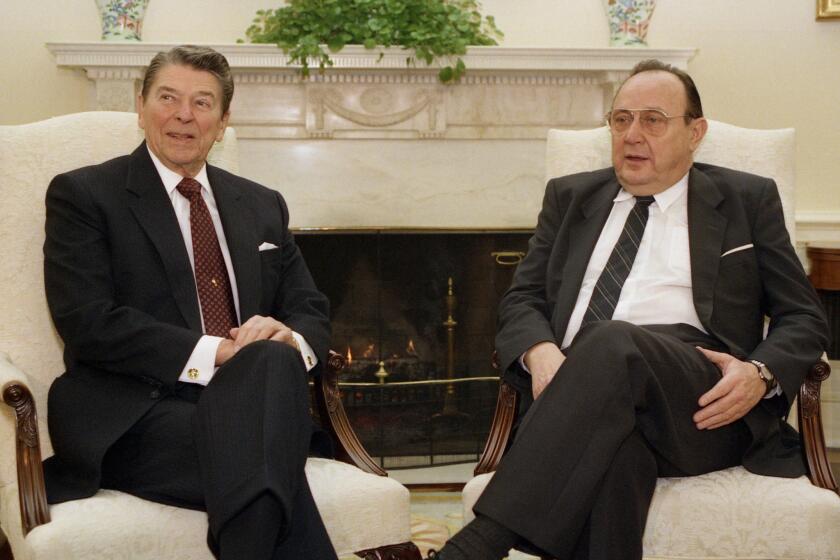 Hans-Dietrich Genscher, West Germany's long-serving foreign minister, visits President Reagan in the Oval Office in 1988.