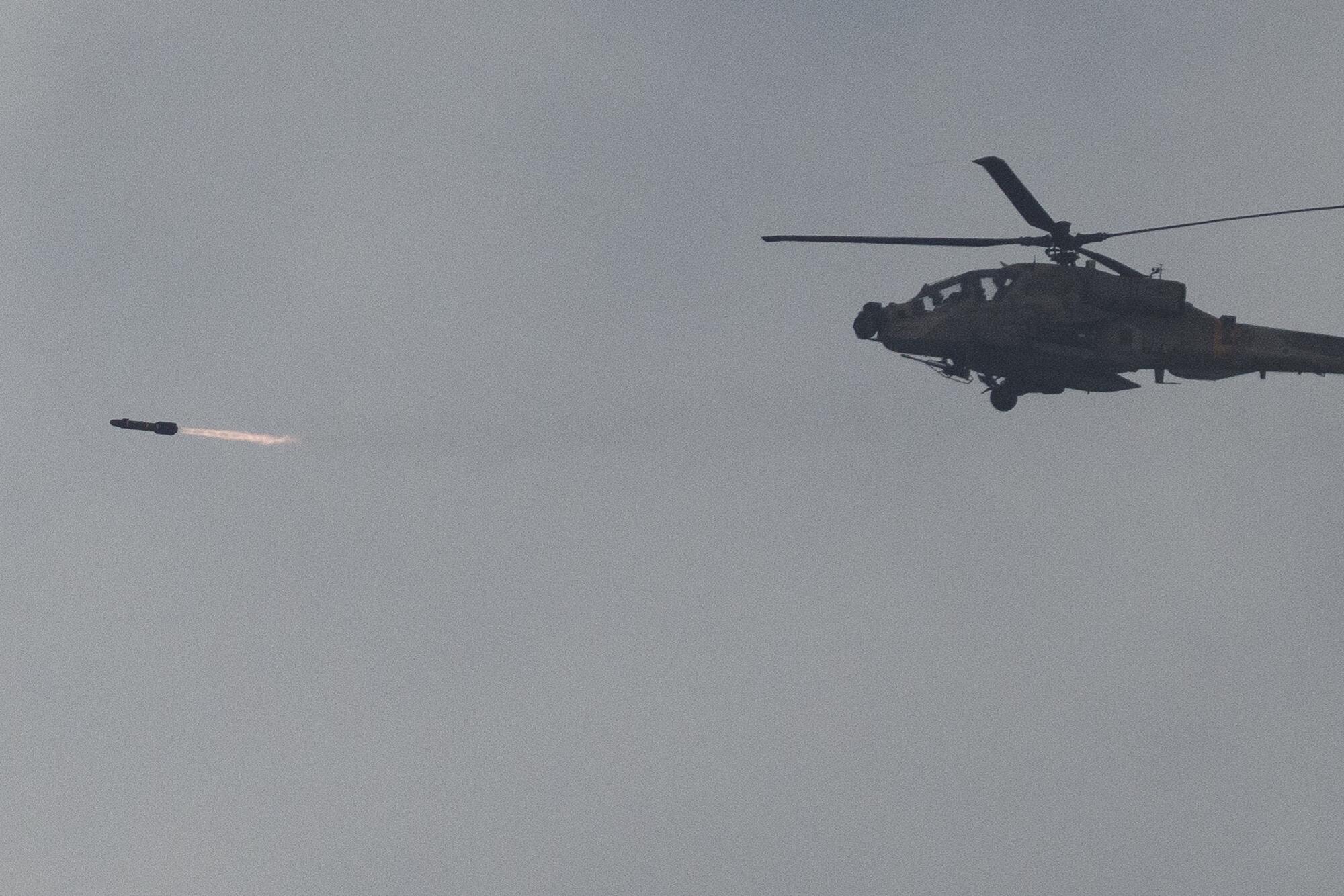 Israeli military helicopter firing a missile