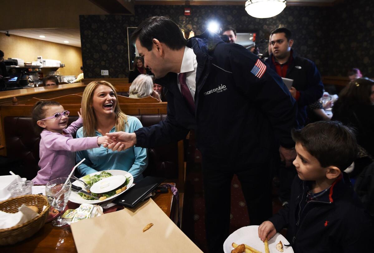 Marco Rubio greets diners in Manchester, N.H.