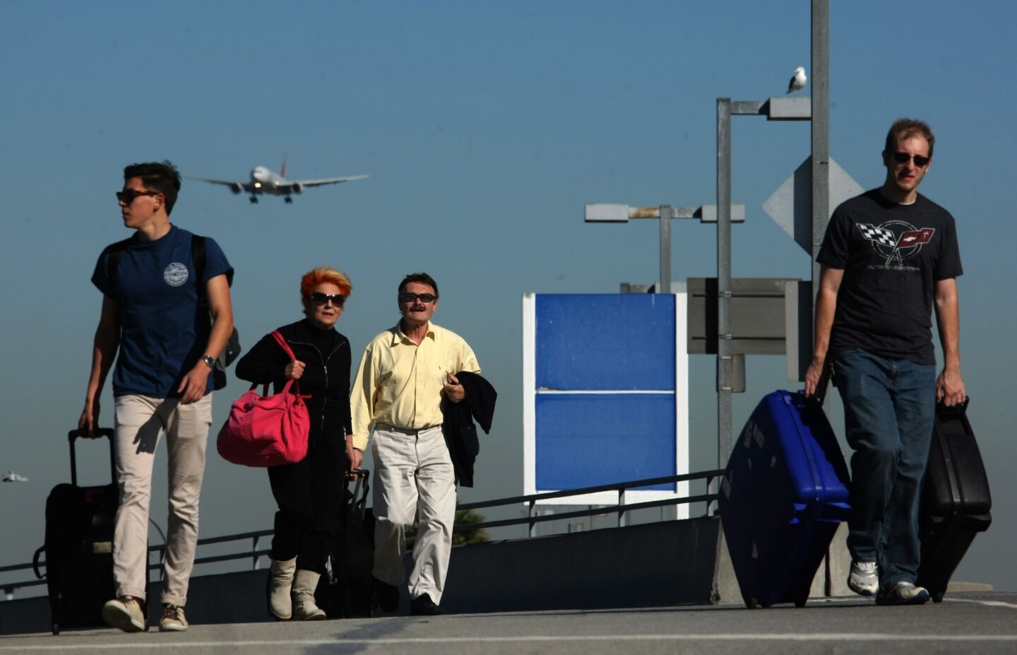 Travelers make their toward LAX on one of the main roads into the airport.