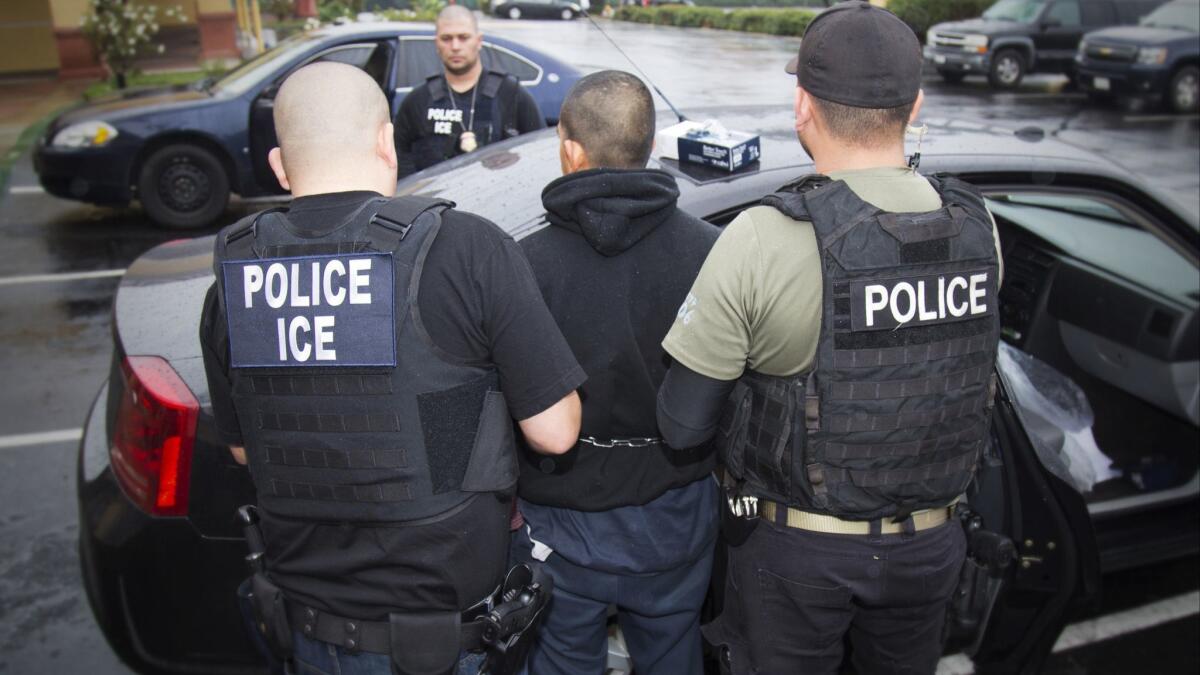 Immigration and Customs Enforcement agents in Los Angeles make an arrest in February. ICE officers in San Diego arrested more than 100 people during a three-day targeted operation this week.