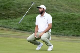 Scottie Scheffler flips his club after missing a birdie putt on the 18th green during the final round.