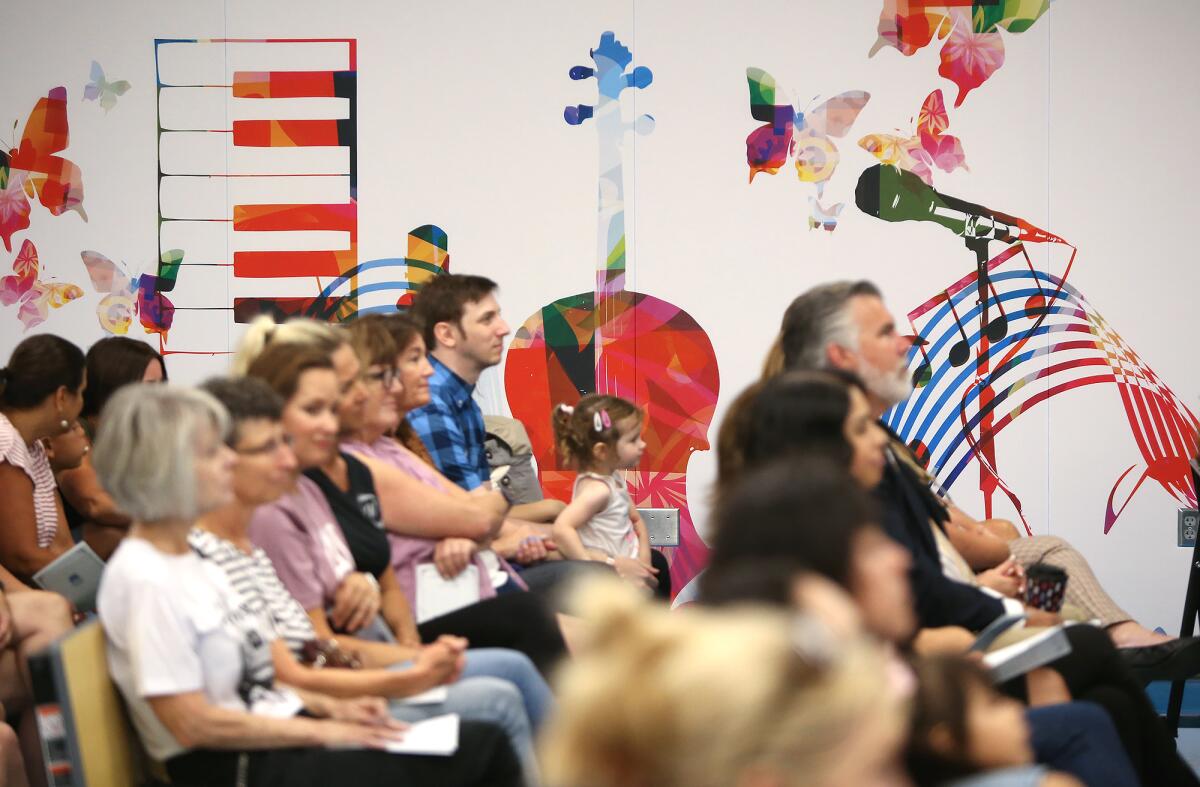 A full house of parents and others listen intently during Thursday's event at the Westmont Elementary Visual and Performing Arts Academy.