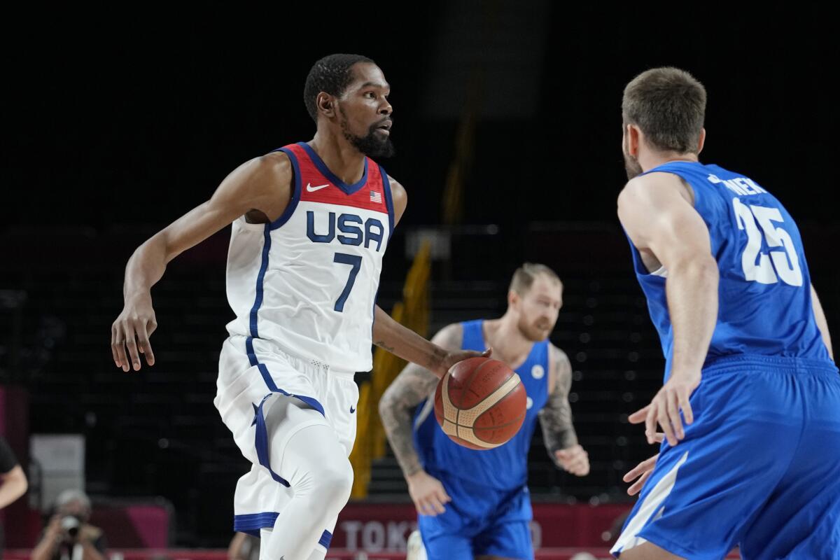 United States' Kevin Durant (7) works the ball up court against the Czech Republic.