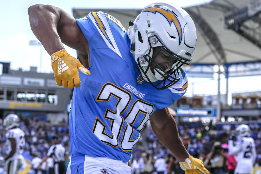 Chargers running back Austin Ekeler dances in the end zone after scoring a touchdown