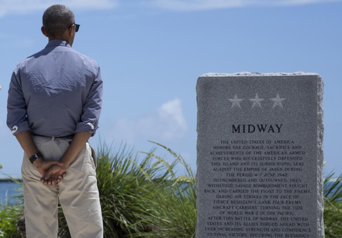 President Obama pauses at the Battle of Midway Navy Memorial in September as he tours Midway Atoll in the Papahanaumokuakea Marine National Monument.
