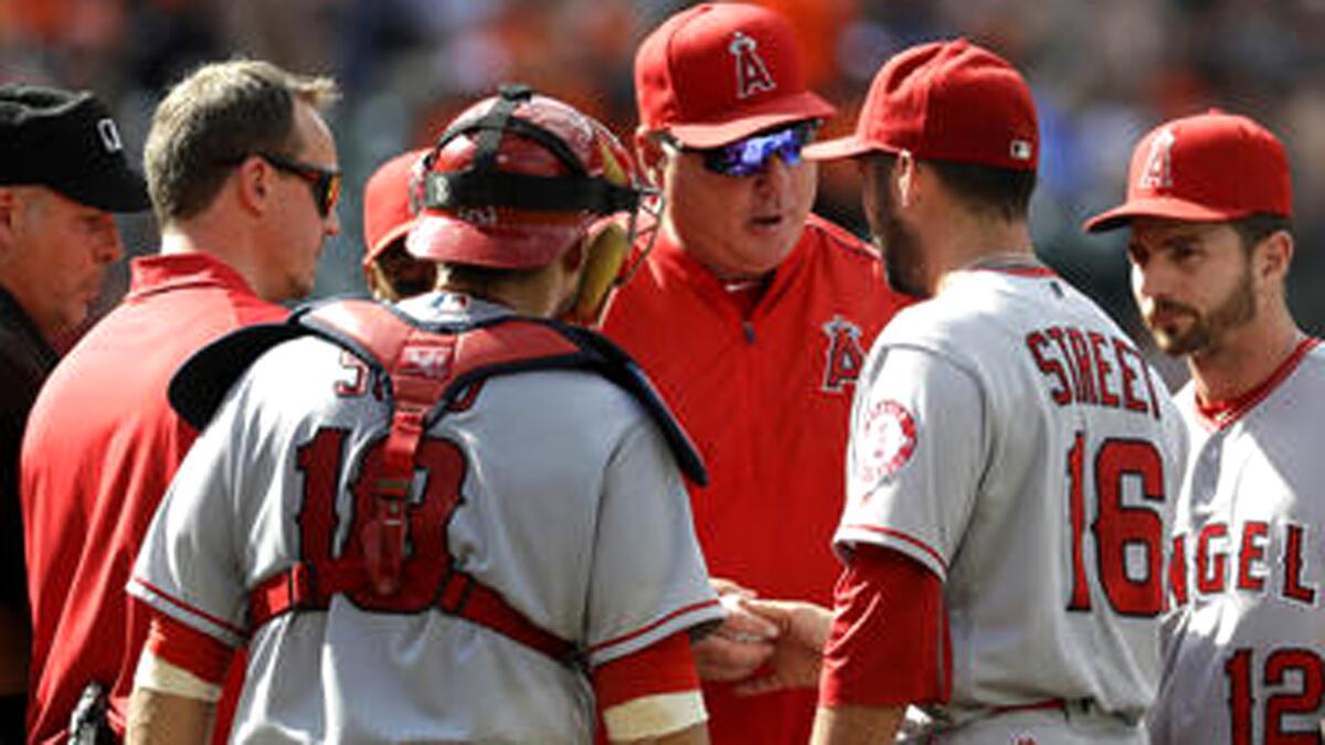 Angels Manager Mike Scioscia, replacing closer Huston Street during a game last season because of cramps in his legs, is an advocate of set roles for relievers.