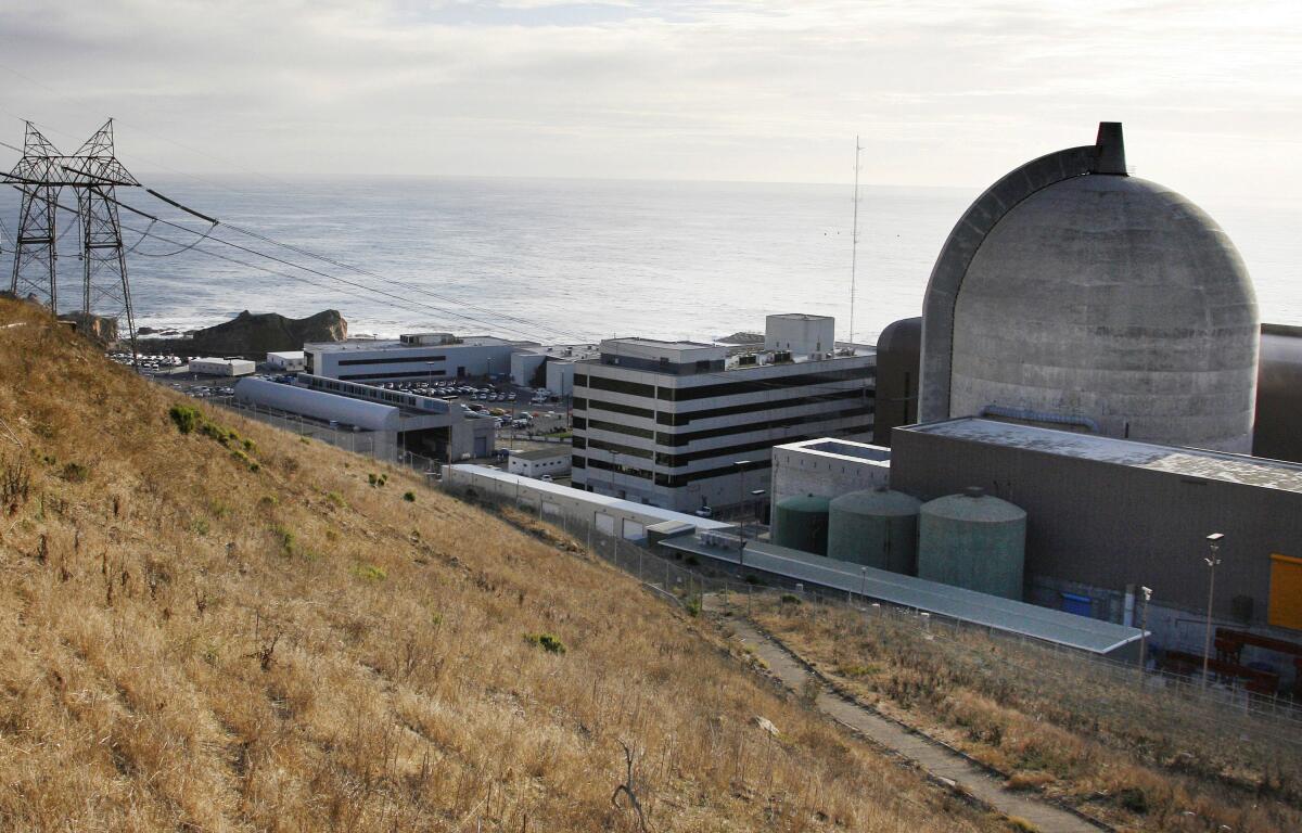 A dome-shaped structure at right is among the buildings at a nuclear power plant.