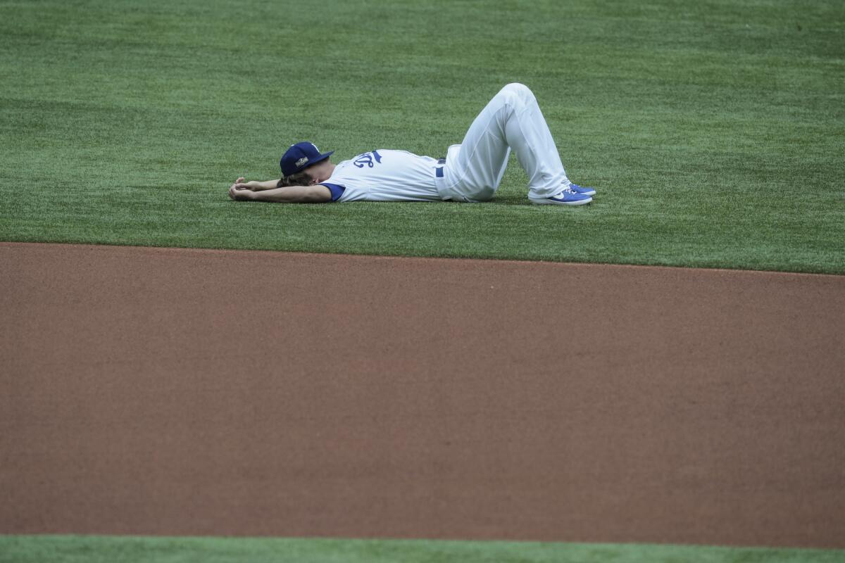 Dodgers shortstop Corey Seager stretches on the field before Game 6 of the NLCS.