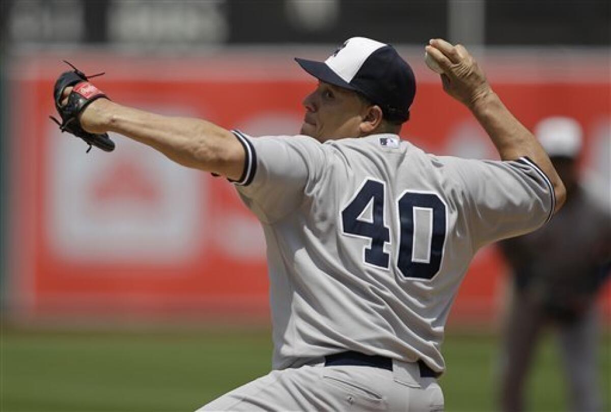 Photo: New York Yankees starting pitcher Bartolo Colon throws a