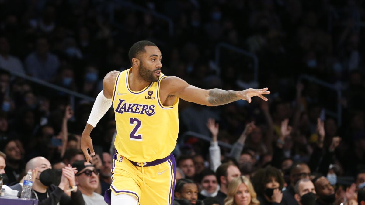 Lakers guard Wayne Ellington reacts after making a three-point shot against the Kings this season.