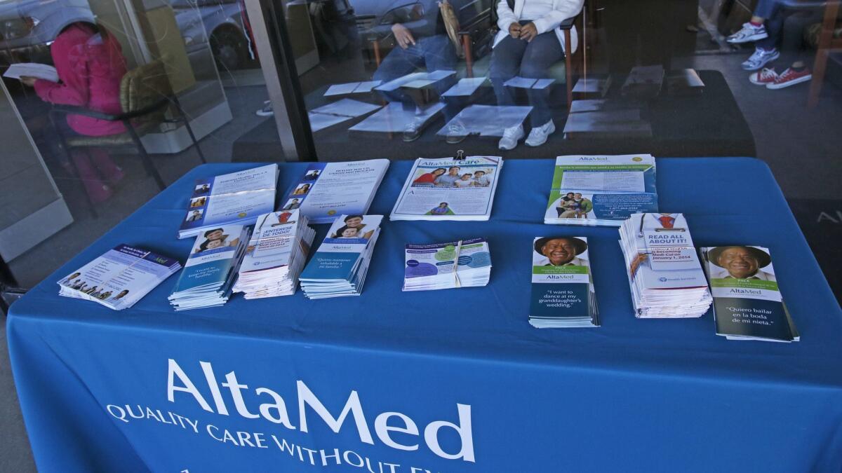 At an AltaMed facility in Commerce, people wait in December 2013 to sign up for healthcare coverage under the Affordable Care Act.