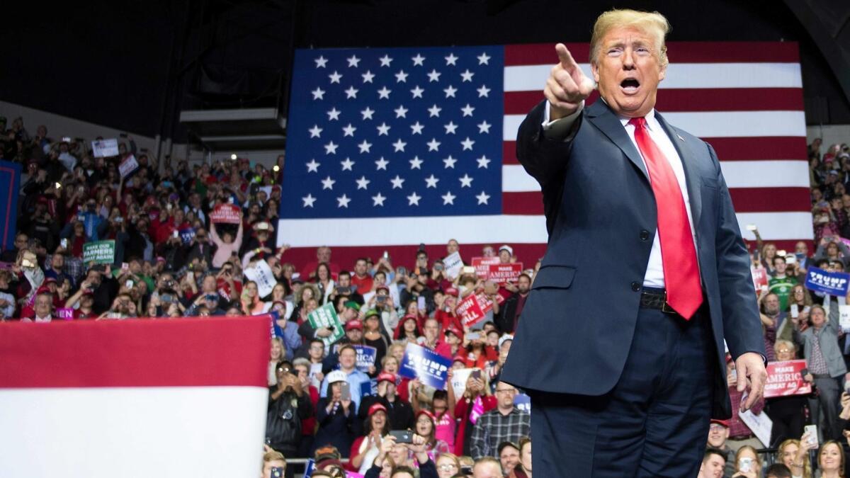 President Trump speaks at a rally in Fort Wayne, Ind., the night before the midterm election.