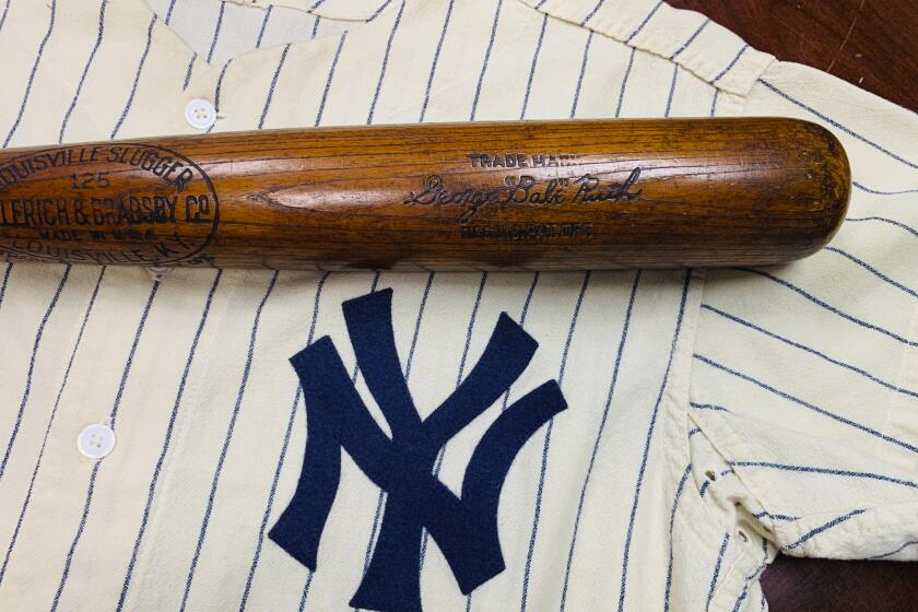 This Nov. 11, 2019 photo released by SCP Auctions, Inc., shows the bat used by Babe Ruth to slug his 500th career home run in 1929. Ruth became the first player to reach the coveted plateau on Aug. 11, 1929, hitting a solo shot for the New York Yankees off Willis Hudlin at League Park in Cleveland. The bat used by the legendary baseball player to hit his 500th home run was auctioned on Saturday for more than $1 million. SCP Auctions didn't identify the buyer. The auction was held in Laguna Niguel, California. Ruth hit his 500th homer on Aug. 11, 1929 in a game against the Cleveland Indians. He was the first of only 27 Major League Baseball players to reach that mark. Ruth gave the autographed bat to his friend,, Jim Rice, and it's been in the family for nearly 75 years. (SCP Auctions, Inc. via AP)