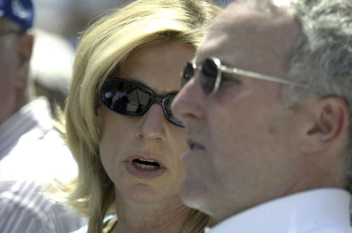 Former Dodgers owners Frank and Jamie McCourt watch a game at Dodger Stadium in April 2005.