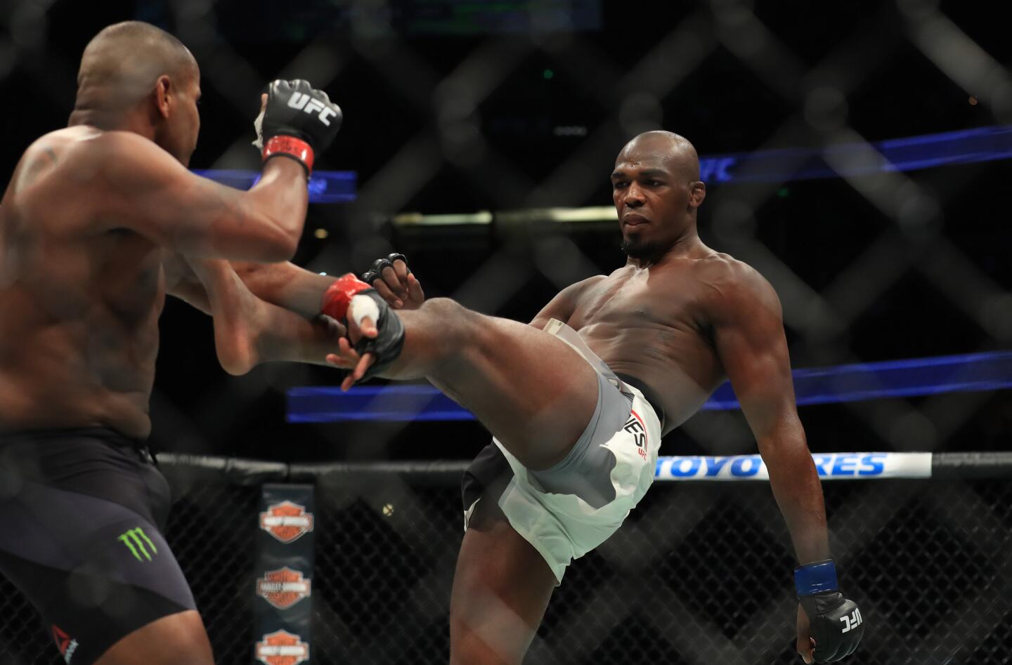 Jon Jones kicks Daniel Cormier during their light-heavyweight title fight at UFC 214 at Honda Center.
