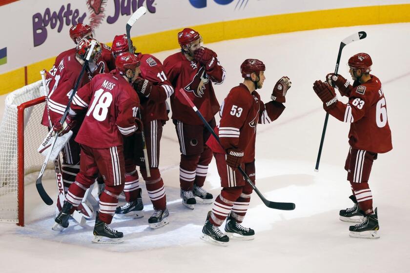 The Phoenix Coyotes celebrate following Saturday's win over the Edmonton Oilers. With a new owner in place, the Coyotes are turning all of their attention back to the ice.