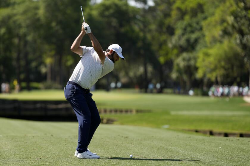 Scottie Scheffler hits his tee shot on the fourth hole during the first round of the RBC Heritage golf tournament, Thursday, April 18, 2024, in Hilton Head, S.C. (AP Photo/Chris Carlson)