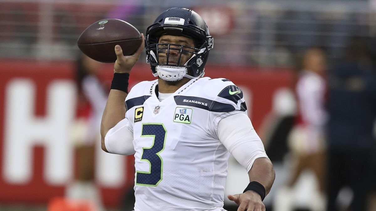 Seattle Seahawks quarterback Russell Wilson passes the ball during a game against the San Francisco 49ers in December.