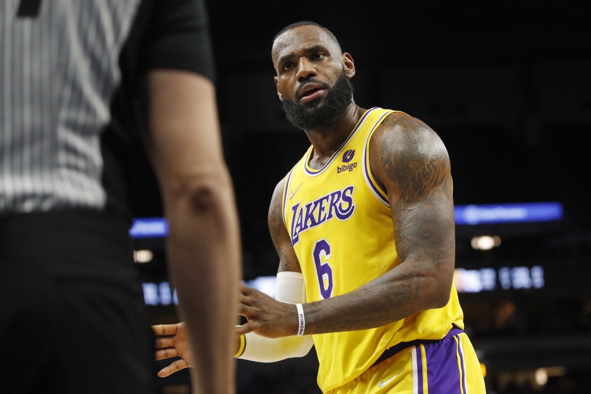 Lakers forward LeBron James questions a referee during the third quarter of the Lakers' loss to the Timberwolves on Friday.