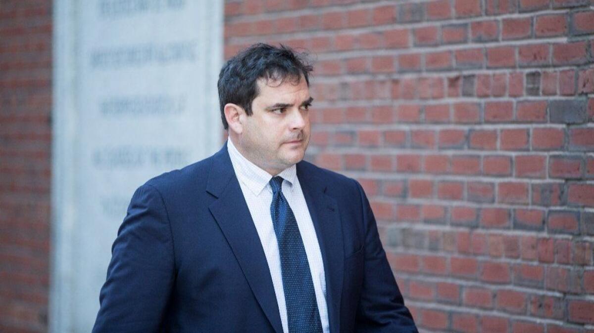 Stanford sailing coach John Vandemoer arrives at a Boston federal court for his arraignment March 12.