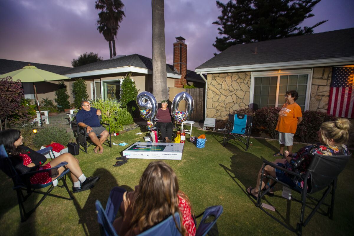 Don Stack celebrates his 90th birthday with a social distancing party on his lawn in July. 