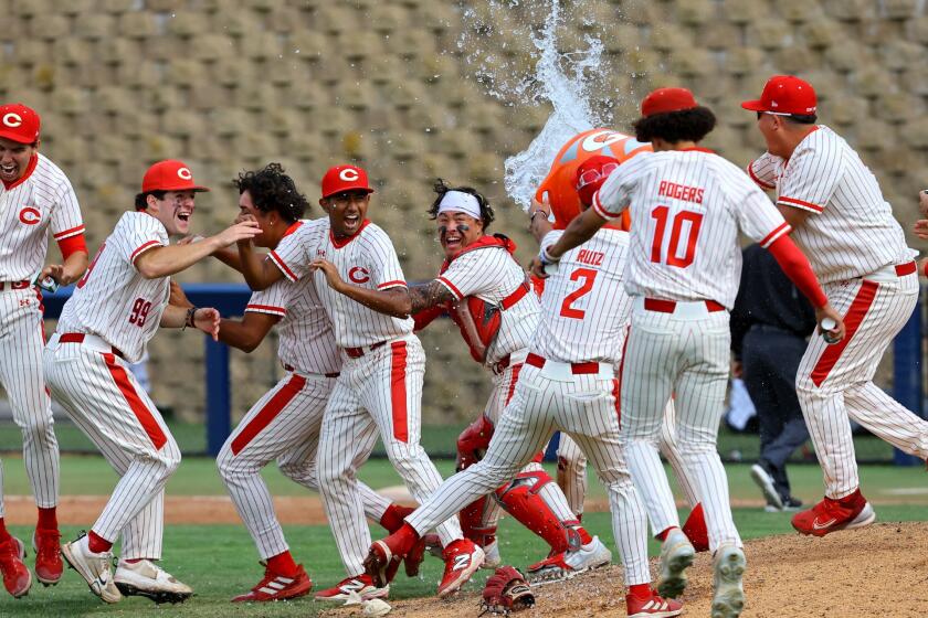 Corona players celebrate winning Boras Classic in San Diego.