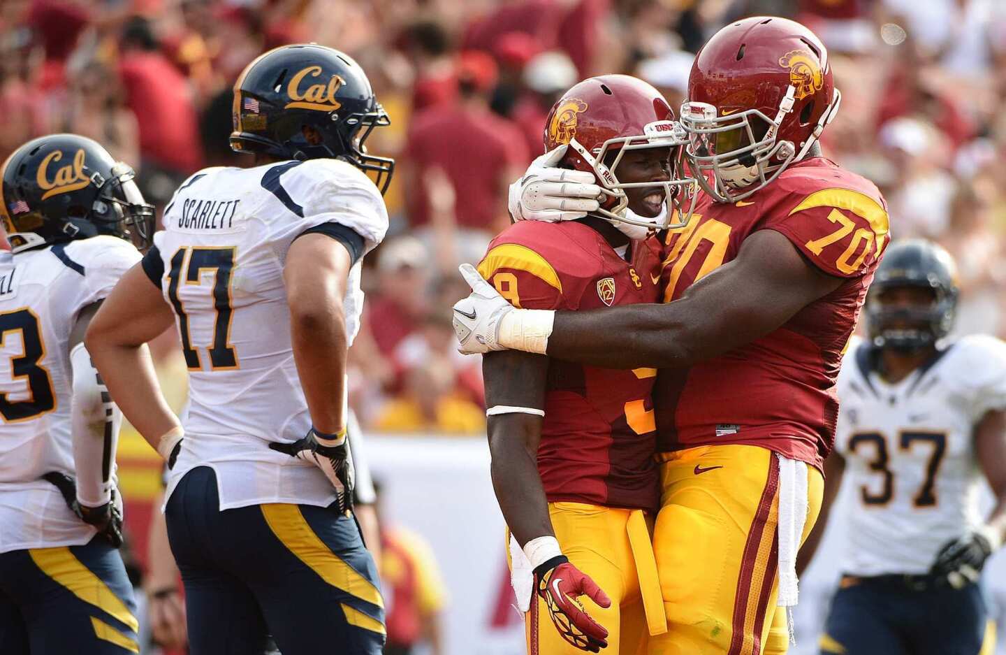 USC receiver Marqise Lee is congratulated by teamma Aundrey Walker after catching a touchdown pass against California on Saturday.