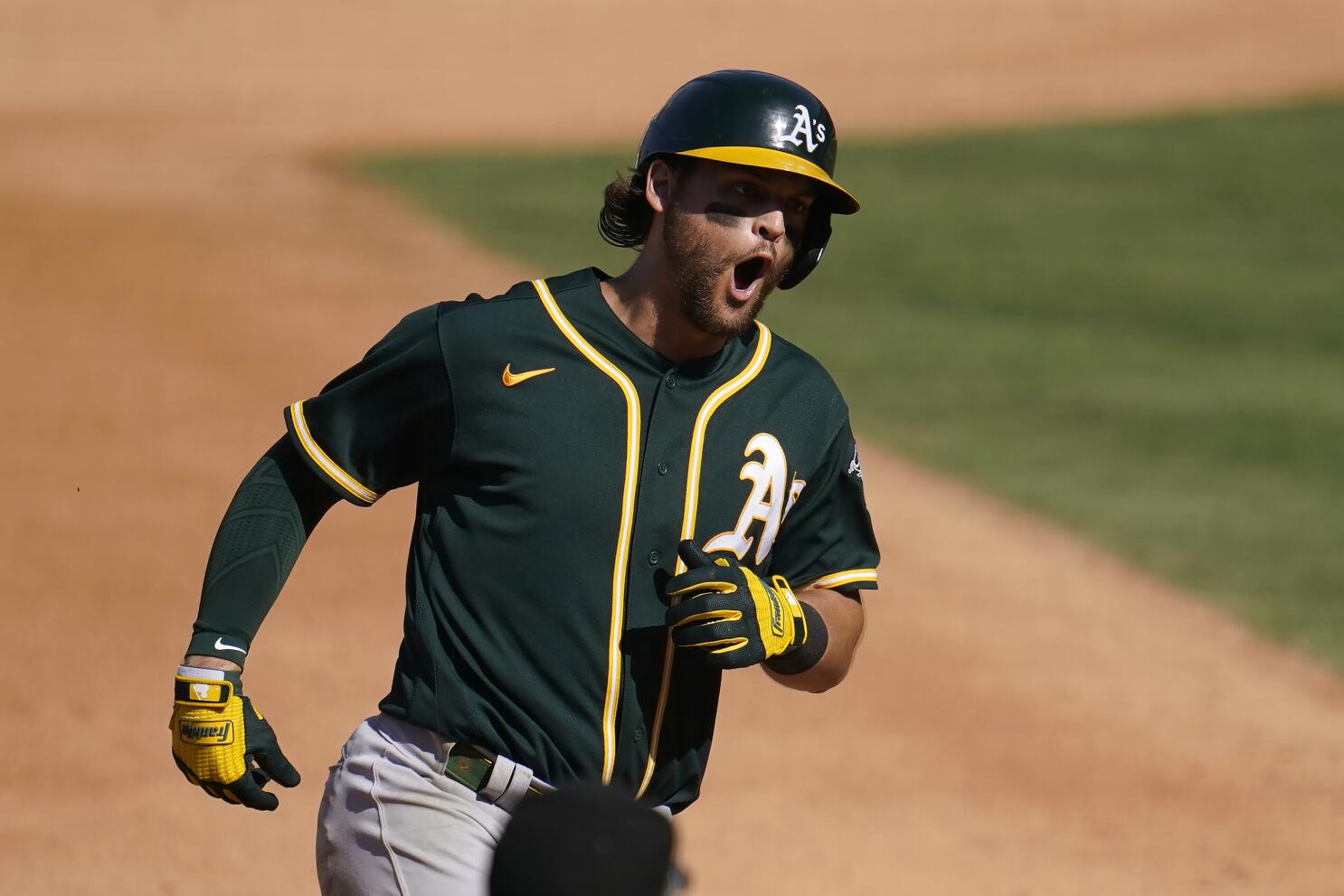 Josh Reddick and his folks on the day he received his Gold Glove