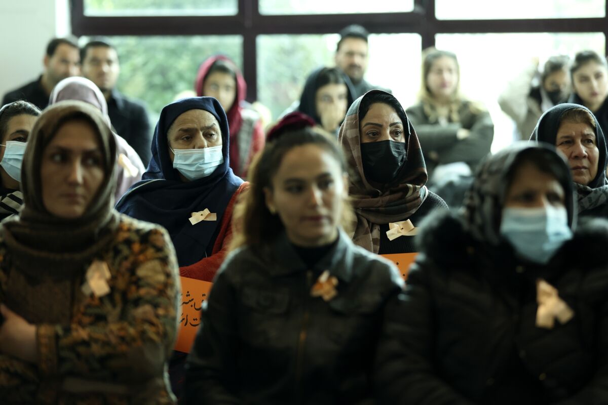 Afghan women take part in the awareness meeting on violence against women, at a coastline tourist resort in Golem, 50 kilometers (30 miles) west of Tirana, Albania, Friday, Dec. 10, 2021. Afghan women evacuated to Albanian after the Taliban came to power in August have made a loud call to the international community to pay attention to their female brethren back at home who are harshly discriminated. (AP Photo/Franc Zhurda)