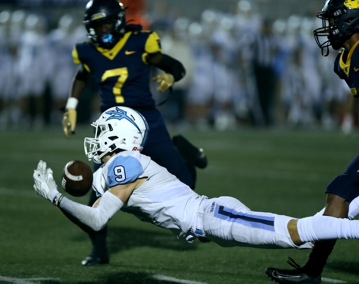 Corona Del Mar wide receiver Cooper Hoch makes a first-half diving catch against Downey Warren on Nov. 5, 2021.