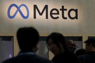 Attendees visit the Meta booth at the Game Developers Conference in San Francisco.