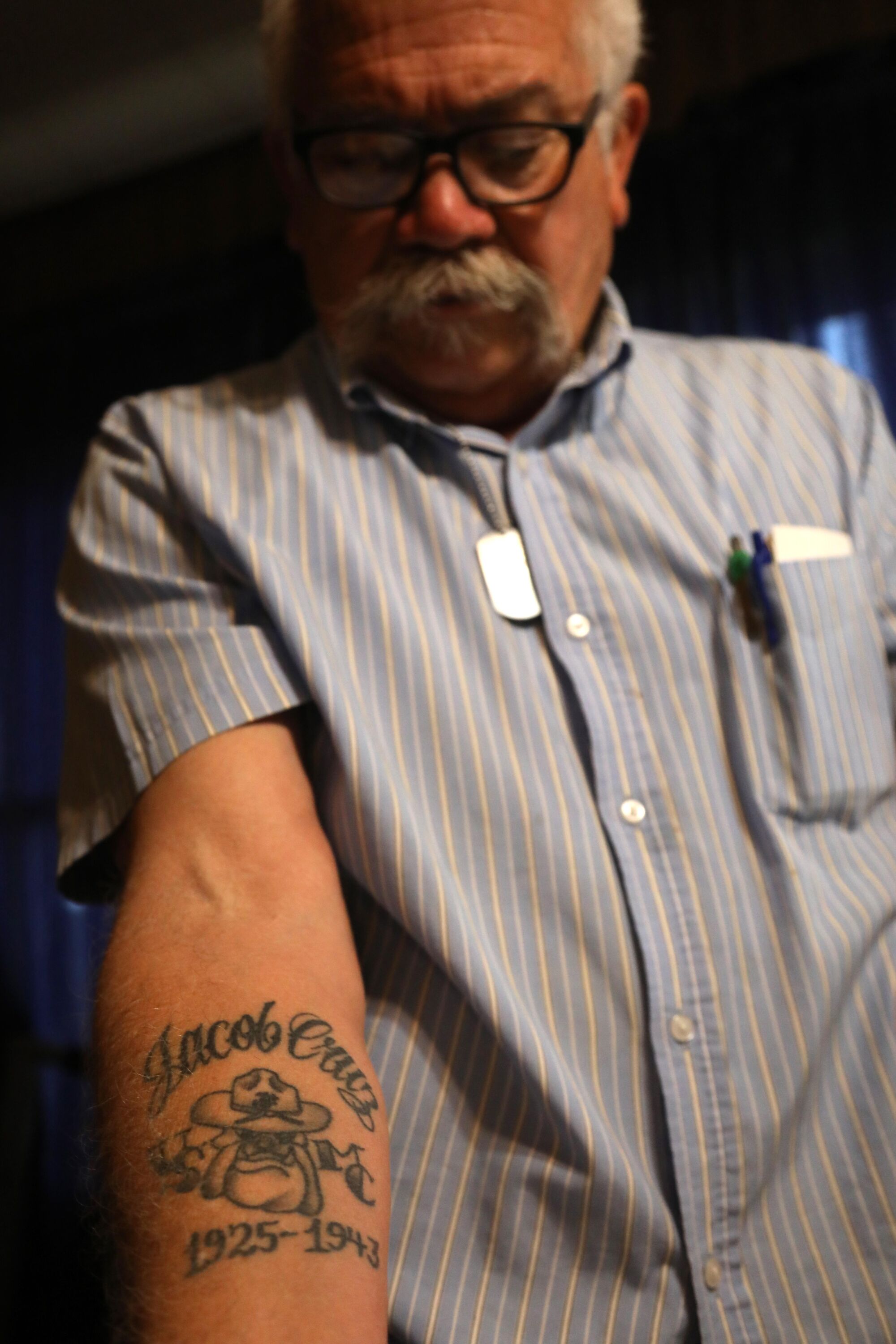 Isaac Cruz III shows his tattoo on his arm that reads "Jacob Cruz" and "1925-1943"