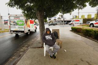 Los Angeles, California-Dec. 29, 2022-Day laborer Gustavo Gutierrez, 65, waits for work outside of U-Haul storage and rental truck in Atwater Village, Los Angeles, CA. on Dec. 29, 2022. (Carolyn Cole / Los Angeles Times)