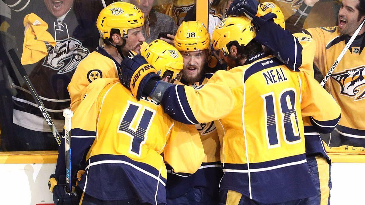 Nashville Predators' Viktor Arvidsson (38) celebrates with his teammates after scoring a goal against the Pittsburgh Penguins during the second period in Game 4 of the Stanley Cup Final, Monday.