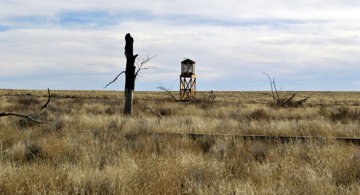 FILE - A rebuilt watchtower stands at Camp Amache, on Jan. 18, 2015, the site of a former World War II-era Japanese-American internment camp in Granada, Colo. On the eve of the 80th anniversary of the forced internment of 120,000 Japanese-Americans at the onset of World war II, Republican U.S. Sen. Mike Lee of Utah is getting backlash for holding up the creation of a national historic site at the former internment camp in extreme southeast Colorado. (AP Photo/Russell Contreras, File)