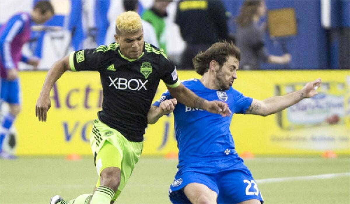 DeAndre Yedlin of the Seattle Sounders, left, battles for the ball with Hernan Bernardello, right, of the Montreal Impact during an MLS game March 23. Yedlin is expected to play for the U.S. national team Wednesday in a friendly match against Mexico at University of Phoenix Stadium.