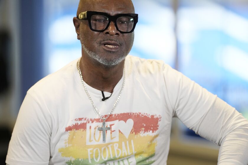 Former Chelsea soccer player Paul Canoville poses for a portrait during an interview with the Associated Press at Stamford Bridge in London, Thursday, March 2, 2023. Black players were only just beginning to integrate into some of England's biggest soccer teams in the 1980s when racism was rife and hooliganism was on the rise. British-born Paul Canoville tells The Associated Press how he was regularly called "the N-word," told to "go home" and had bananas thrown at him when he played for Chelsea. Even more astounding to him was the source of the vitriol. Canoville says "it was the majority of my own fans." (AP Photo/Alastair Grant)