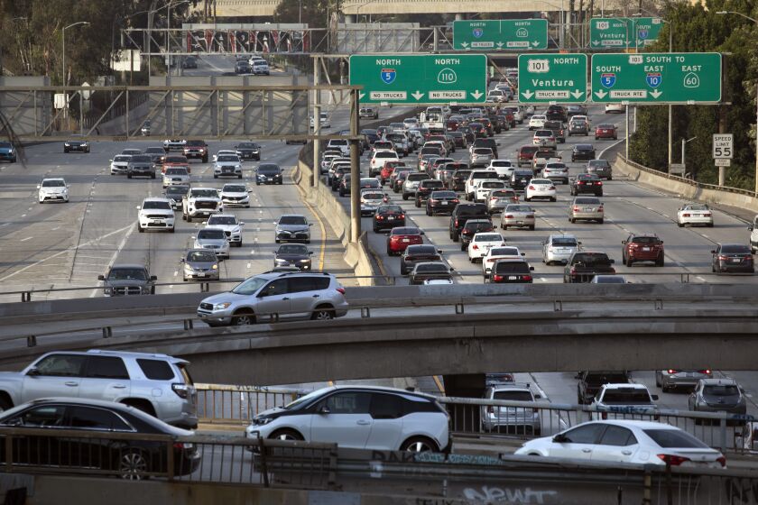 LOS ANGELES, CA - JUNE 16: Afternoon traffic returns to downtown Los Angeles on Wednesday, June 16, 2021. Few changes are a greater indicator of the city's return to the "before" times than the resurgence of traffic. (Myung J. Chun / Los Angeles Times)
