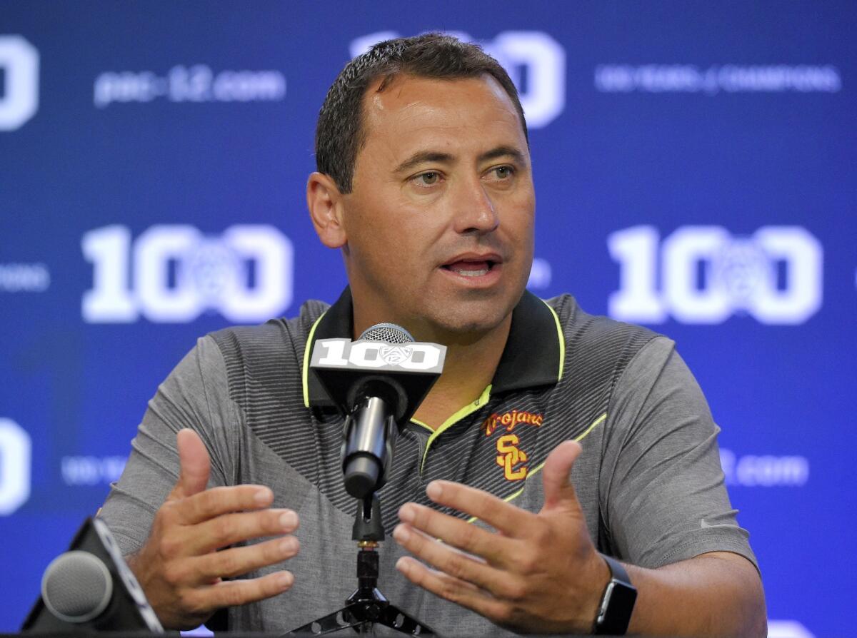 Then-USC coach Steve Sarkisian speaks to reporters during Pac-12 media days on July 31, 2015.
