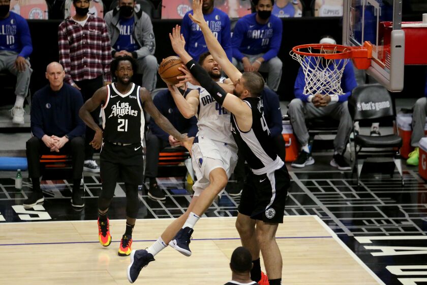LOS ANGELES, CA - MAY 22:. Clippers fcenter Ivaca Zubac fouls Mevericks forward Maxi Kleber uring the first quarter in Los Angeles on Saturday, May 22, 2021 in Los Angeles, CA. (Luis Sinco / Los Angeles Times)