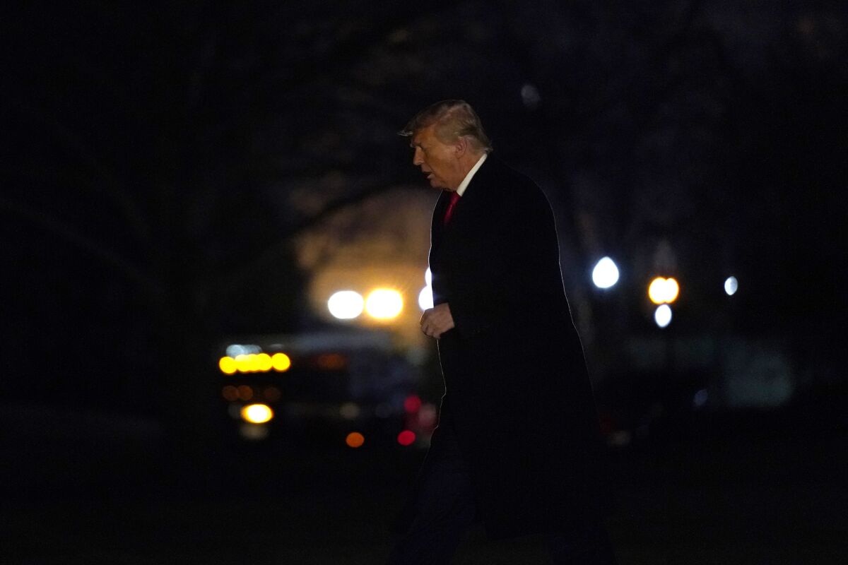 President Donald Trump arrives on the South Lawn of the White House, Tuesday, Jan. 12, 2021, in Washington.