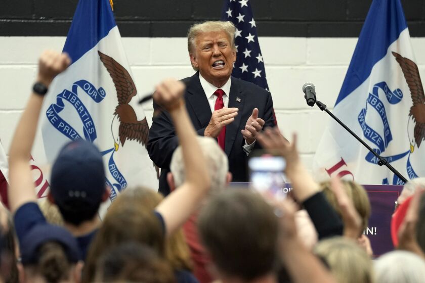 Former President Donald Trump reacts as he visits with campaign volunteers at the Grimes Community Complex Park, Thursday, June 1, 2023, in Des Moines, Iowa. (AP Photo/Charlie Neibergall)