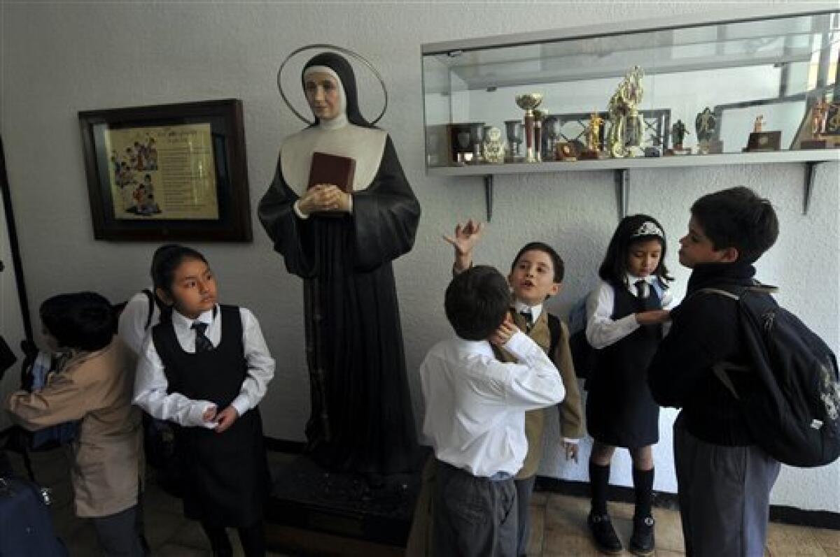 Students of the Blas Canas school attend their first day of classes in Santiago, Monday, March 8, 2010. Hundred of schools are still closed after an 8.8-magnitude earthquake struck central Chile last Feb. 27, causing widespread damage. (AP Photo/Jorge Sanchez)