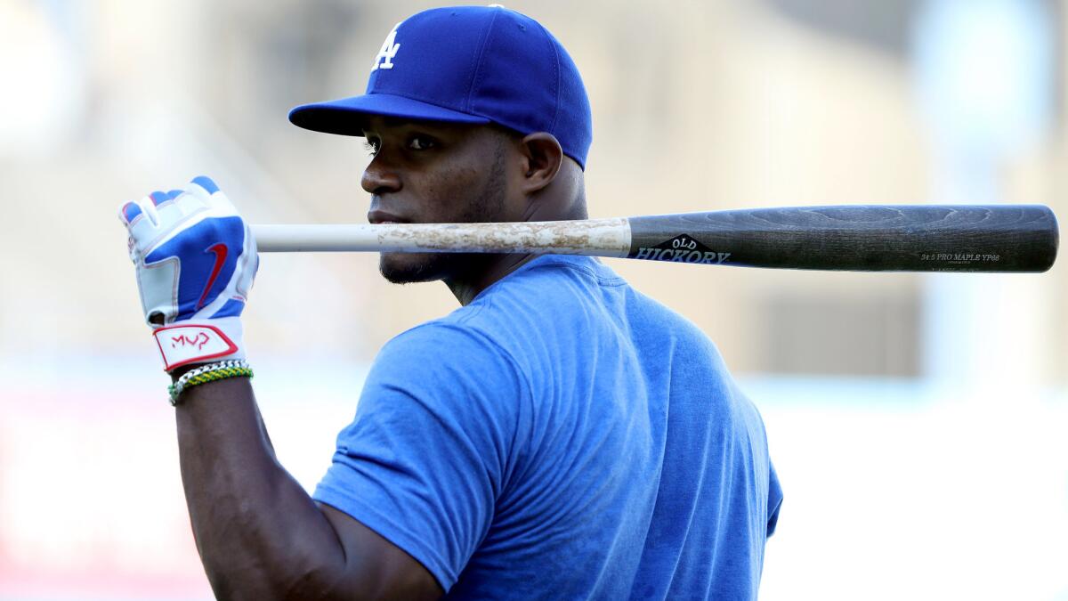 Dodgers outfielder Yasiel Puig prepares to take batting practice before the game Friday at Dodger Stadium.