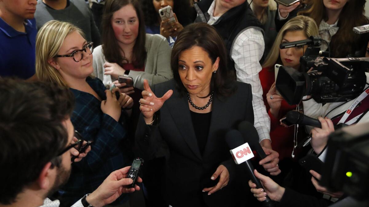 Sen. Kamala Harris (D-Calif.) center, speaks to reporters at Drake University in Des Moines on Monday. Harris formally announced Sunday that she was seeking the Democratic presidential nomination.