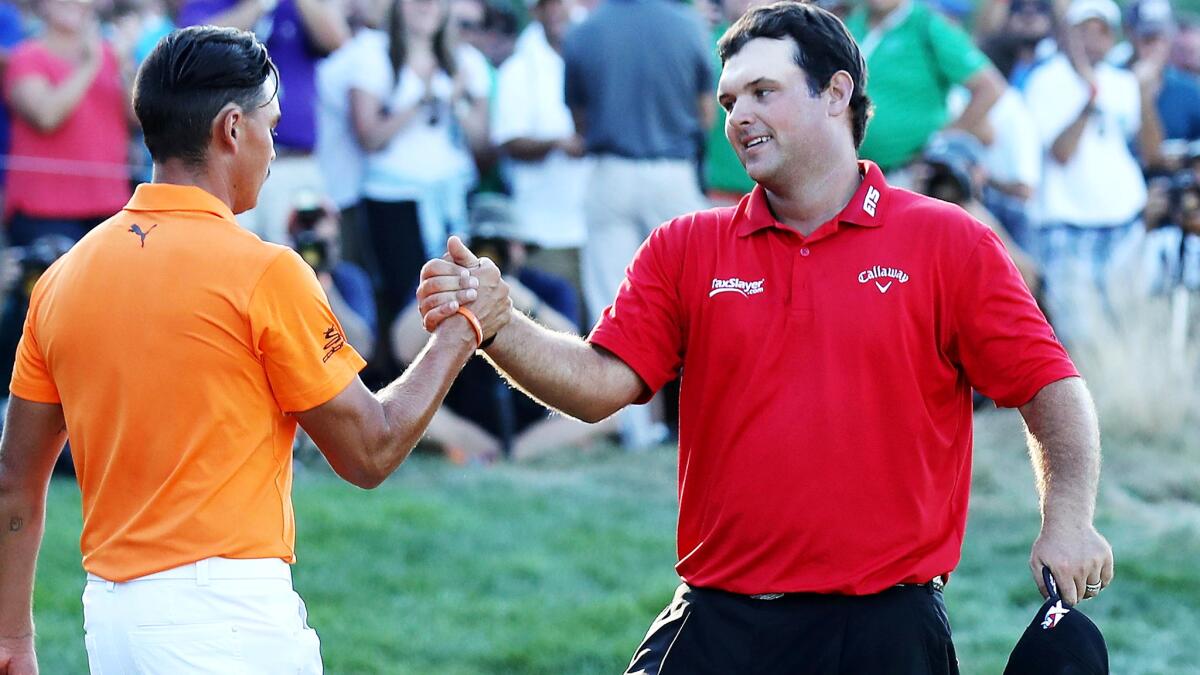 Patrick Reed, right, is congratulated by Rickie Fowler after winning the Barclays on Sunday.